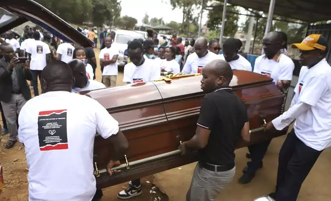 Relatives and friends carry the casket of Ugandan Olympic athlete Rebecca Cheptegei outside Moi Teaching and Referral Hospital morgue in the western city of Eldoret, in Rift Valley, Kenya Friday, Sept. 13, 2024. (AP Photo/Andrew Kasuku)