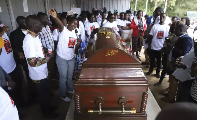 Relatives and friends view the body of Ugandan Olympic athlete Rebecca Cheptegei at Moi Teaching and Referral Hospital morgue in the western city of Eldoret, in Rift Valley, Kenya Friday, Sept. 13, 2024. (AP Photo/Andrew Kasuku)