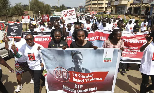 Activists and relatives of Ugandan Olympic athlete Rebecca Cheptegei march calling for an end to femicide in the western city of Eldoret, in Rift Valley, Kenya Friday, Sept. 13, 2024. (AP Photo/Andrew Kasuku)