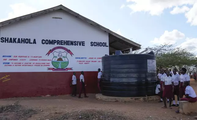 Shakahola Comprehensive School children play outside the classrooms near the scene where dozens of bodies were found in shallow graves in the village of Shakahola, near the coastal city of Malindi, in southern Kenya, on Thursday, Sept. 5, 2024. (AP Photo/Brian Inganga)