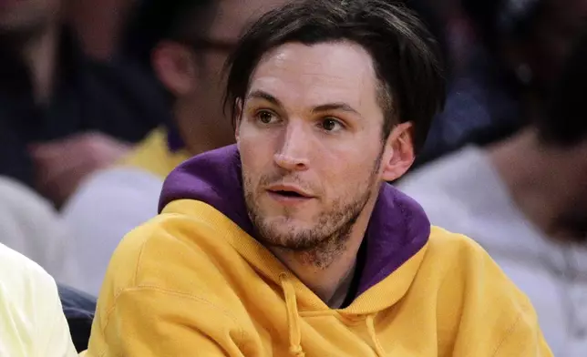 FILE - Musician Josh Klinghoffer attends an NBA basketball game between the Los Angeles Lakers and the Los Angeles Clippers in Los Angeles, March 6, 2014. (AP Photo/Jae C. Hong, File)