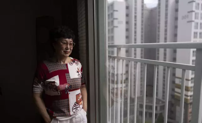 Han Tae-soon, who believed her daughter had been missing for years before discovering she had been adopted by a family in the United States, stands for a portrait at her home in Anyang, South Korea, Saturday, June 1, 2024. (AP Photo/Jae C. Hong)