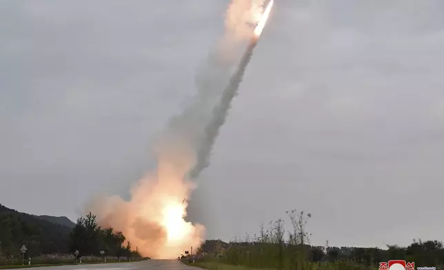 This undated photo provided on Friday, Sept. 13, 2024, by the North Korean government shows what they say is test-firing from their new launch vehicle of 600mm multiple rockets at an undisclosed location in North Korea. Independent journalists were not given access to cover the event depicted in this image distributed by the North Korean government. The content of this image is as provided and cannot be independently verified. Korean language watermark on image as provided by source reads: "KCNA" which is the abbreviation for Korean Central News Agency. (Korean Central News Agency/Korea News Service via AP)