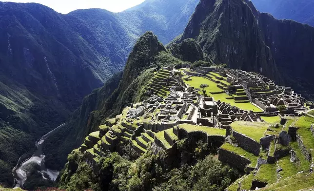 This 2021 aerial photo shows Machu Picchu in Peru. The popular travel destination is included in a new guide book for LGBTQ+ travelers, “Out in the World,” by the couple behind The Nomadic Boys travel blog, Stefan Arestis and Sebastien Chaneac. (Brand g Vacations via AP)