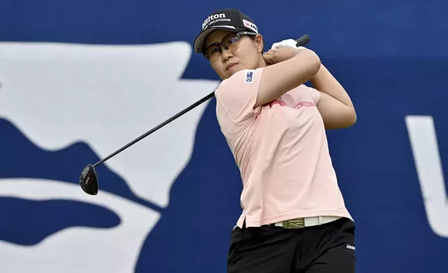 Nasa Hataoka, of Japan, watches her shot off the first tee during the first round of the LPGA Walmart NW Arkansas Championship golf tournament, Friday, Sept. 27, 2024, in Rogers, Ark. (AP Photo/Michael Woods)