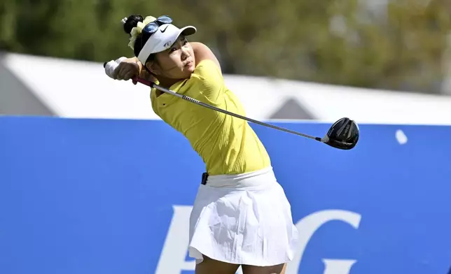 Lucy Li, of the United States, hits her tee shot on the 18th hole during the final round of the LPGA Walmart NW Arkansas Championship golf tournament, Sunday, Sept. 29, 2024, in Rogers, Ark. (AP Photo/Michael Woods)