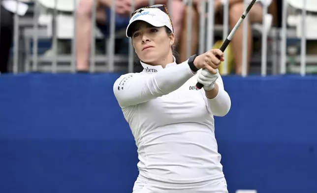 Gaby Lopez, from Mexico, watches her shot off the first tee during the first round of the LPGA Walmart NW Arkansas Championship golf tournament, Friday, Sept. 27, 2024, in Rogers, Ark. (AP Photo/Michael Woods)