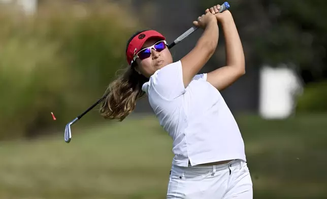 Maria Marin watches her shot off the 11th tee during the first round of the LPGA Walmart NW Arkansas Championship golf tournament, Friday, Sept. 27, 2024, in Rogers, Ark. (AP Photo/Michael Woods)