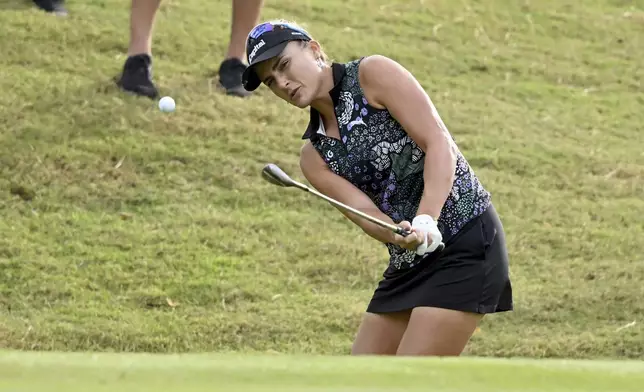 Lexi Thompson hits onto the 16th green during the first round of the LPGA Walmart NW Arkansas Championship golf tournament, Friday, Sept. 27, 2024, in Rogers, Ark. (AP Photo/Michael Woods)