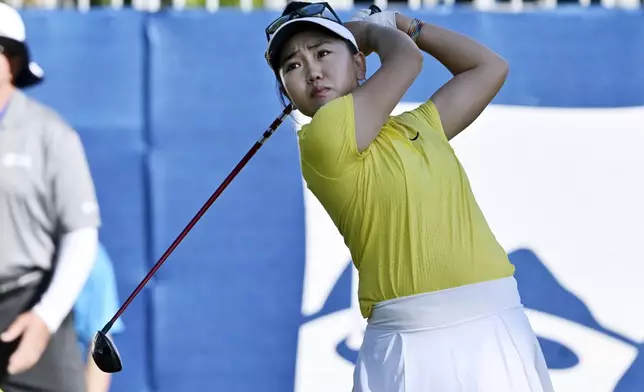 Lucy Li, of the United States, hits her tee shot on the first hole during the final round of the LPGA Walmart NW Arkansas Championship golf tournament, Sunday, Sept. 29, 2024, in Rogers, Ark. (AP Photo/Michael Woods)