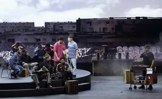 Actors perform during a rehearsal of La Haine musical show, in Tremblay en France, Tuesday, Sept. 17, 2024. (AP Photo/Christophe Ena)