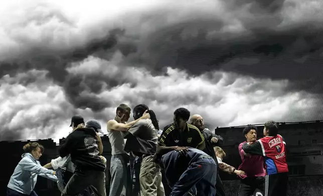 Actors perform during a rehearsal of La Haine musical show, in Tremblay en France, Tuesday, Sept. 17, 2024. (AP Photo/Christophe Ena)