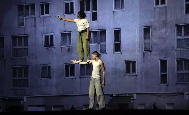 Actors perform during a rehearsal of La Haine musical show, in Tremblay en France, Tuesday, Sept. 17, 2024. (AP Photo/Christophe Ena)