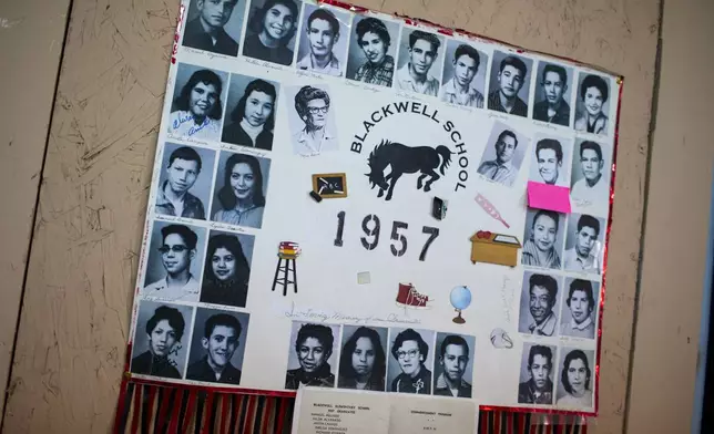 A display with photos of the 1957 class of the Blackwell School decorates the classroom during the inauguration day of the school as the newest National Historic Site in Marfa, Texas, Saturday, Sept. 14, 2024. (AP Photo/Andres Leighton)