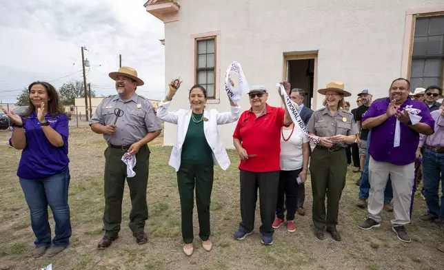 Secretary of the Interior Deb Haaland, center left, Blackwell School alumni Joe Cabezuela, center right, National Park Service Director Chuck Sams, second from left, and NPS Intermountain Regional Director Kate Hammond, second from right, react after cutting the ribbon to inaugurate Blackwell School as the newest National Historic Site in Marfa, Texas, Saturday, Sept. 14, 2024. (AP Photo/Andres Leighton)