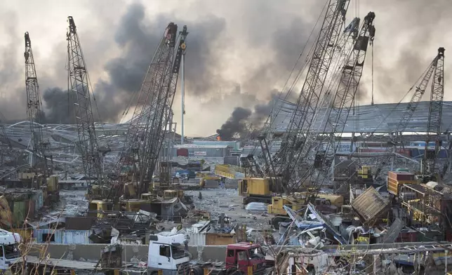 FILE - Smoke rises after a massive explosion at the port in Beirut, on Aug. 4, 2020. (AP Photo/Hassan Ammar, File)