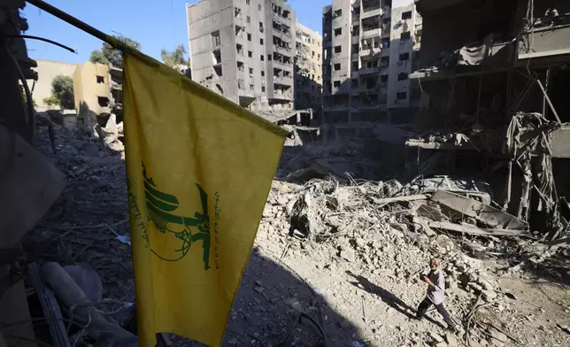 A Hezbollah flag at the site of the assassination of Hezbollah leader Hassan Nasrallah in Beirut's southern suburbs, Sunday, Sept. 29, 2024. (AP Photo/Hassan Ammar)