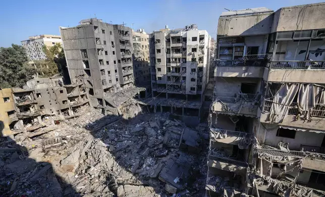 Damaged buildings at the site of the assassination of Hezbollah leader Hassan Nasrallah in Beirut's southern suburbs, Sunday, Sept. 29, 2024. (AP Photo/Hassan Ammar)