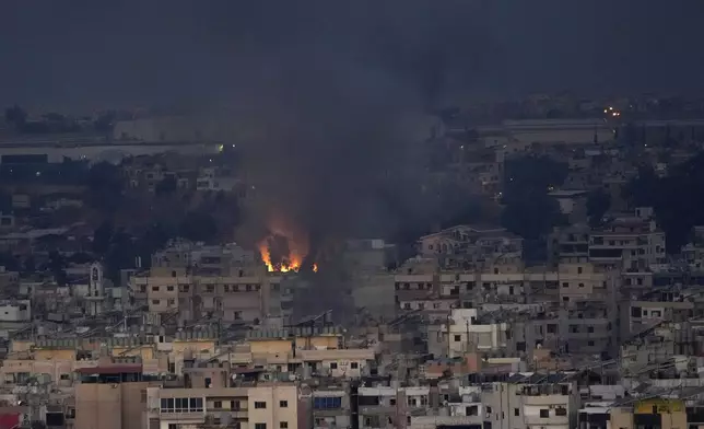 Flame and smoke rise from Israeli airstrikes hit a residential area that is a Hezbollah stronghold, in the southern suburbs of Beirut, Lebanon, Saturday, Sept. 28, 2024. (AP Photo/Hussein Malla)