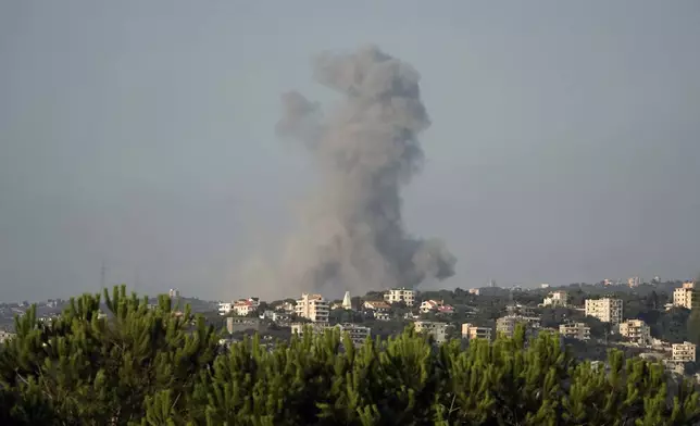 Smoke rises from an Israeli airstrike north of Beirut, in the village of Ras Osta, Byblos district, seen from Maaysrah, Lebanon, Wednesday, Sept. 25, 2024. (AP Photo/Bilal Hussein)