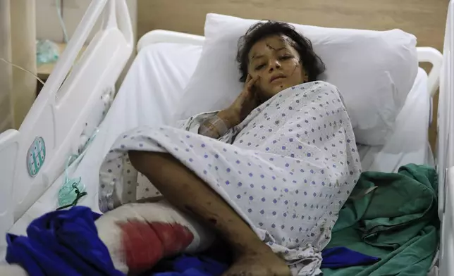 A wounded girl lies in a hospital bed in the southern village of Saksakieh, Lebanon, Tuesday, Sept. 24, 2024. (AP Photo/Mohammed Zaatari)