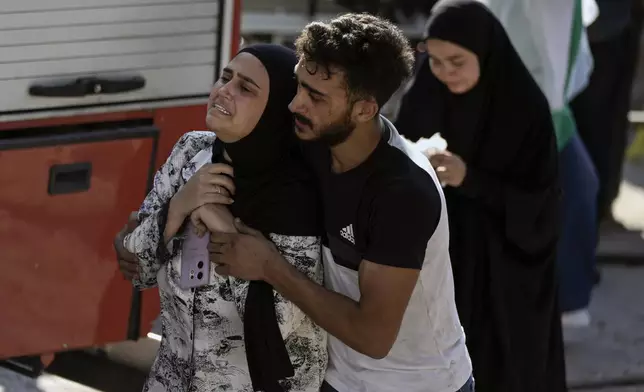 A woman reacts at the scene of an Israeli airstrike in the town of Maisara, north of Beirut, Wednesday, Sept. 25, 2024. (AP Photo/Bilal Hussein)