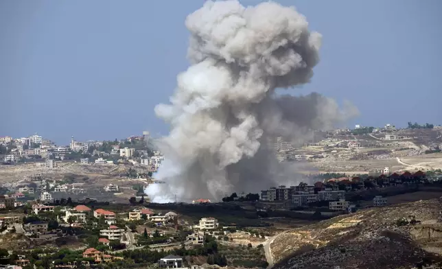 Smoke rises from Israeli shelling on villages in the Nabatiyeh district, seen from the southern town of Marjayoun, Lebanon, Monday, Sept. 23, 2024. (AP Photo/Hussein Malla)