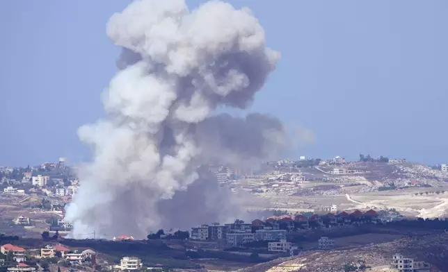 Smoke rises from Israeli airstrikes on villages in the Nabatiyeh district, seen from the southern town of Marjayoun, Lebanon, Monday, Sept. 23, 2024.(AP Photo/Hussein Malla)