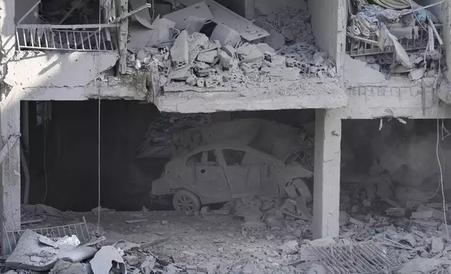 A destroyed building at the site of an Israeli airstrike in Beirut's southern suburbs, Sunday, Sept. 29, 2024. (AP Photo/Hassan Ammar)