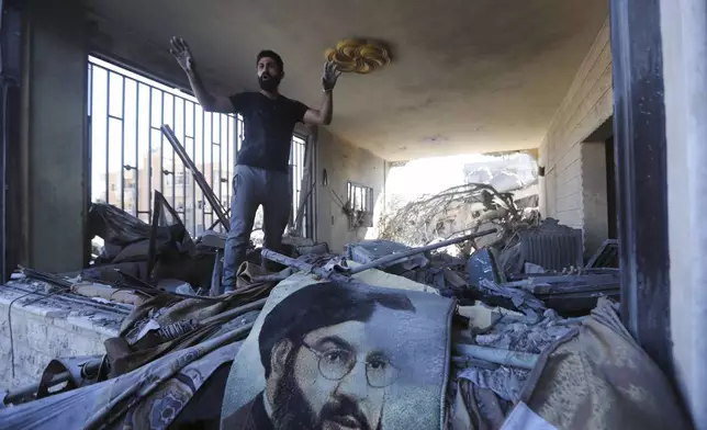 A man reacts in a damaged apartment at the site of an Israeli airstrike in Saksakieh, south Lebanon, Thursday, Sept. 26, 2024. (AP Photo/Mohammed Zaatari)