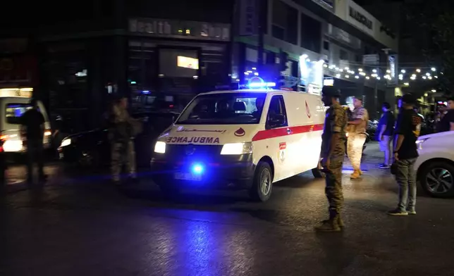 An ambulance carrying wounded people whose handheld pager exploded arrives outside at the American University hospital, in Beirut, Lebanon, Tuesday, Sept. 17, 2024. (AP Photo/Hassan Ammar)