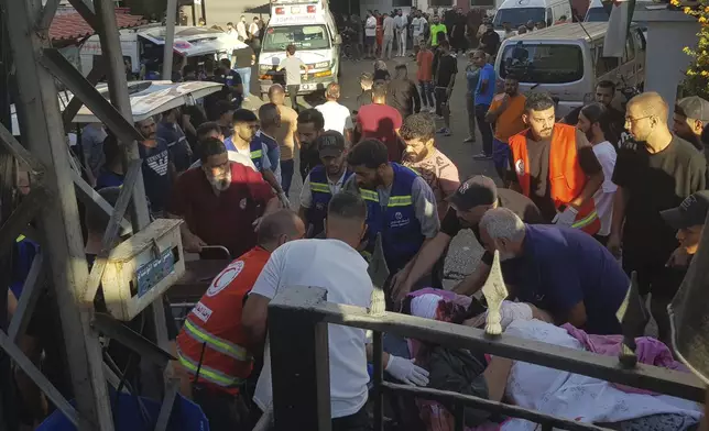 Civil Defense first-responders carry a man who was wounded after his handheld pager exploded, in the southern port city of Sidon, Lebanon, Tuesday, Sept. 17, 2024.(AP Photo)