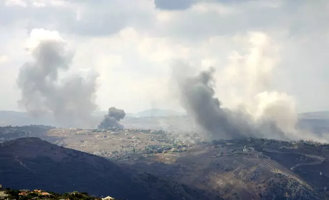 Smoke rises from Israeli airstrikes on Taybeh village, seen from the southern town of Marjayoun, Lebanon, Monday, Sept. 23, 2024.(AP Photo/Hussein Malla)