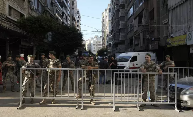 Lebanese soldiers secure the area a day after an Israeli missile strike in Beirut's southern suburbs, Saturday, Sept. 21, 2024. (AP Photo/Bilal Hussein)