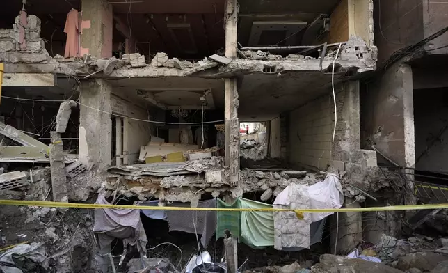 A damaged building at the site of Friday's Israeli strike in Beirut's southern suburbs, Saturday, Sept. 21, 2024. (AP Photo/Bilal Hussein)