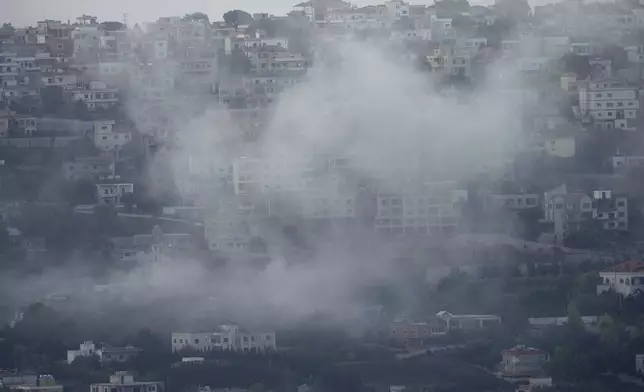 Smoke rises from an Israeli airstrike on Khiam village, as seen from Marjayoun town, south Lebanon, Monday, Sept. 23, 2024. (AP Photo/Hussein Malla)