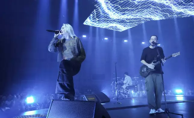 Emily Armstrong, from left, Colin Brittain, and Mike Shinoda of Linkin Park performs Thursday, Sept. 5, 2024, in Los Angeles. It was announced on Thursday that Dead Sara's Emily Armstrong would join as the band's new co-singer and songwriter/producer Colin Brittain would join on drums. Linkin Park will release the album "From Zero" on Nov. 15, marking their first new record since former frontman Chester Bennington died in 2017. (Photo by Jordan Strauss/Invision/AP