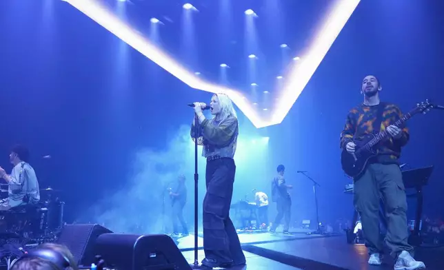 Colin Brittain, from left, Emily Armstrong, and Mike Shinoda of Linkin Park performs Thursday, Sept. 5, 2024, in Los Angeles. It was announced on Thursday that Dead Sara's Emily Armstrong would join as the band's new co-singer and songwriter/producer Colin Brittain would join on drums. Linkin Park will release the album "From Zero" on Nov. 15, marking their first new record since former frontman Chester Bennington died in 2017. (Photo by Jordan Strauss/Invision/AP