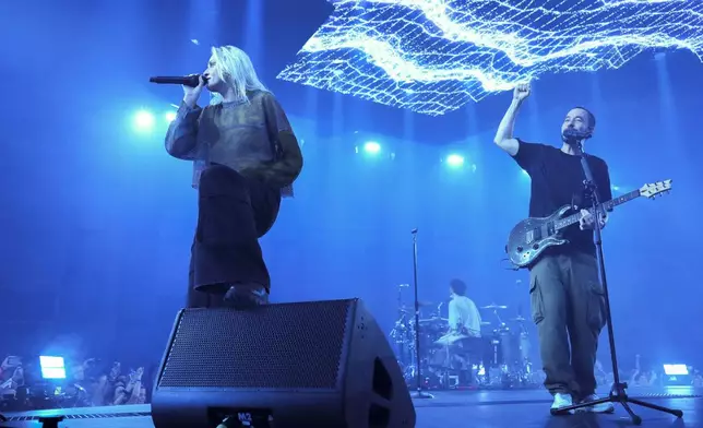 Emily Armstrong, from left, Colin Brittain, and Mike Shinoda of Linkin Park performs Thursday, Sept. 5, 2024, in Los Angeles. It was announced on Thursday that Dead Sara's Emily Armstrong would join as the band's new co-singer and songwriter/producer Colin Brittain would join on drums. Linkin Park will release the album "From Zero" on Nov. 15, marking their first new record since former frontman Chester Bennington died in 2017. (Photo by Jordan Strauss/Invision/AP