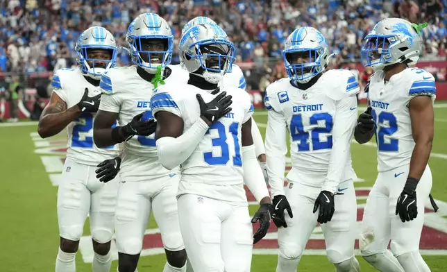 Detroit Lions safety Kerby Joseph (31) reacts to his interception of a Arizona Cardinals quarterback Kyler Murray pass during the second half of an NFL football game Sunday, Sept. 22, 2024, in Glendale, Ariz. (AP Photo/Ross D. Franklin)