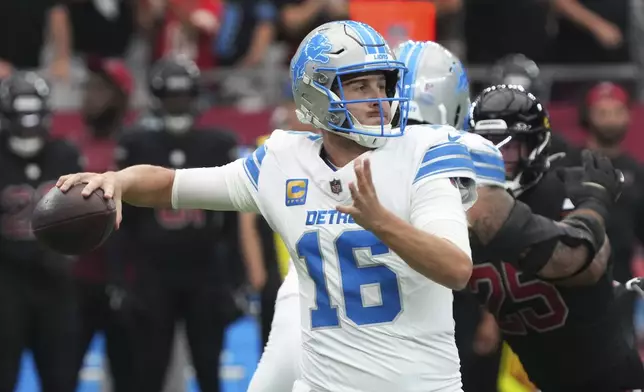 Detroit Lions quarterback Jared Goff (16) throws against the Arizona Cardinals during the first half of an NFL football game Sunday, Sept. 22, 2024, in Glendale, Ariz. (AP Photo/Rick Scuteri)