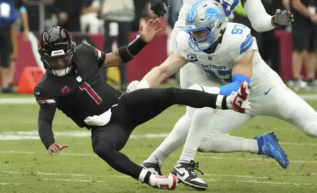 Arizona Cardinals quarterback Kyler Murray (1) is hit by Detroit Lions defensive end Aidan Hutchinson (97) during the second half of an NFL football game Sunday, Sept. 22, 2024, in Glendale, Ariz. (AP Photo/Rick Scuteri)