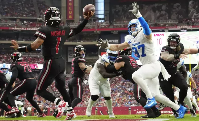 Detroit Lions defensive end Aidan Hutchinson (97) applies pressure to Arizona Cardinals quarterback Kyler Murray (1) during the second half of an NFL football game Sunday, Sept. 22, 2024, in Glendale, Ariz. (AP Photo/Ross D. Franklin)