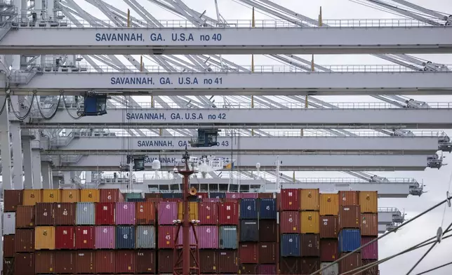 FILE - In this photo provided by the Georgia Ports Authority, a vessel is loaded with containers by several ship to shore crane at the Georgia Ports Authority's Port of Savannah Garden City Terminal, on Oct. 21, 2021, in Savannah, Ga. (Stephen B. Morton/Georgia Port Authority via AP, File)