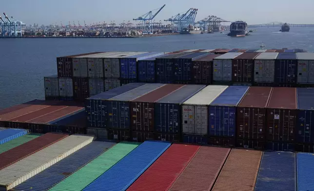 FILE - A container ship makes it way toward the Port of New York and New Jersey in Elizabeth, N.J., on June 30, 2021. (AP Photo/Seth Wenig, File)