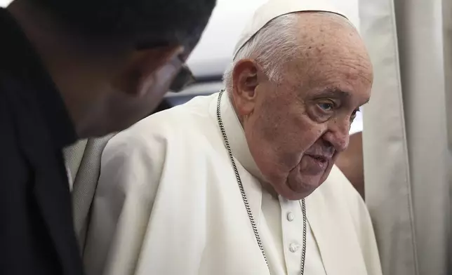 Pope Francis is aboard his flight bound for Luxembourg, where he will start a four-day apostolic journey in Luxembourg and Belgium, Thursday, Sept. 26, 2024. (Guglielmo Mangiapane/Pool Photo via AP)