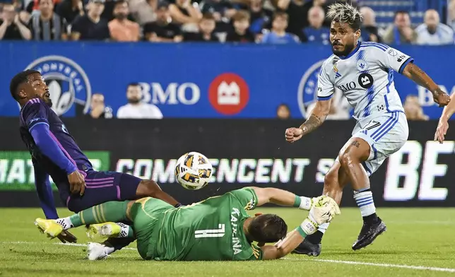 Montreal forward Josef Martínez (17) moves in on Charlotte goalkeeper Kristijan Kahlina (1) during the first half of an MLS soccer match in Montreal, Saturday, Sept. 14, 2024. (Graham Hughes/The Canadian Press via AP)