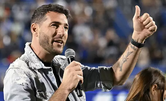 Former Montreal player Ignacio Piatti salutes the crowd after having his name inducted onto the club's Wall of Fame during an MLS soccer match between Montreal and Charlotte in Montreal, Saturday, Sept. 14, 2024. (Graham Hughes/The Canadian Press via AP)