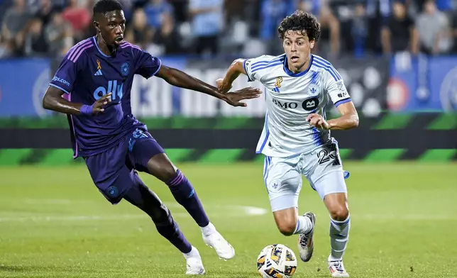 Charlotte's Djibril Diani, left, moves in on Montreal's Caden Clark (23) during the first half of an MLS soccer match in Montreal, Saturday, Sept. 14, 2024. (Graham Hughes/The Canadian Press via AP)