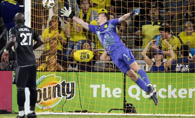 Nashville SC goalkeeper Joe Willis (1) lets shot on goal get past to score during the second half of an MLS soccer match against FC Cincinnati, Saturday, Sept. 21, 2024, in Nashville, Tenn. (AP Photo/George Walker IV)